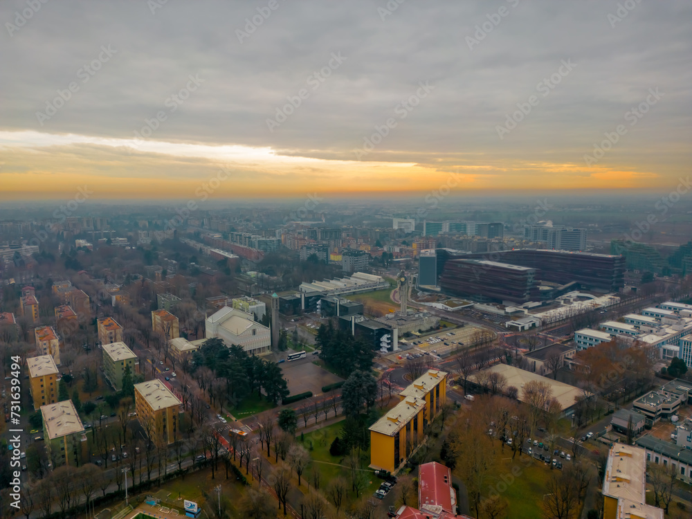 Cityscape top view. Italian city view from a drone Sunset in cloudy weather, view from a drone of the city of San Donato Milanese, Milan, Italy. 