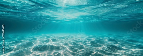 Mesmerizing underwater view as sunlight filters through crystal-clear blue ocean water  creating patterns