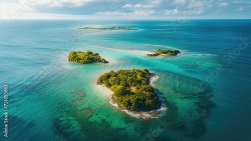 Aerial view of tropical islands with lush greenery and turquoise waters.