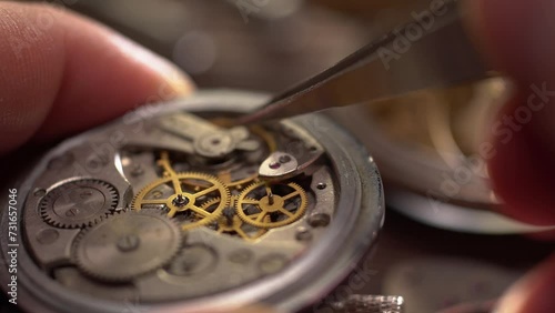 Mechanical watch repair. Watchmaker's workshop. Gear replacement