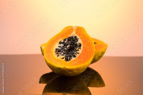 Papaya fruit on brown background. Fresh organic Papaya exotic fruits close up. Healthy vegan papayas 