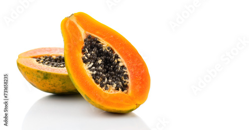 Papaya fruit isolated on white background. Halved fresh organic Papaya exotic fruits close up. Healthy vegan food