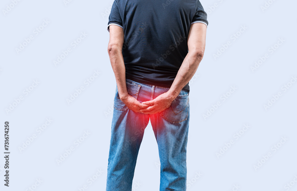Person with hemorrhoid problem isolated. Elderly people with digestive problem touching his
