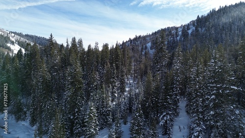 Canvas Print Aerial view of snow covered mountain landscape under blue sky