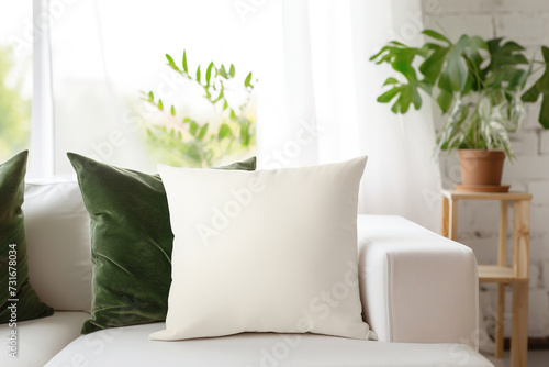 Cozy living room scene with a white square pillow. Blank cushion case template for your graphic design presentation. Pillow cover mock up for print, personalized illustration. Close-up. photo