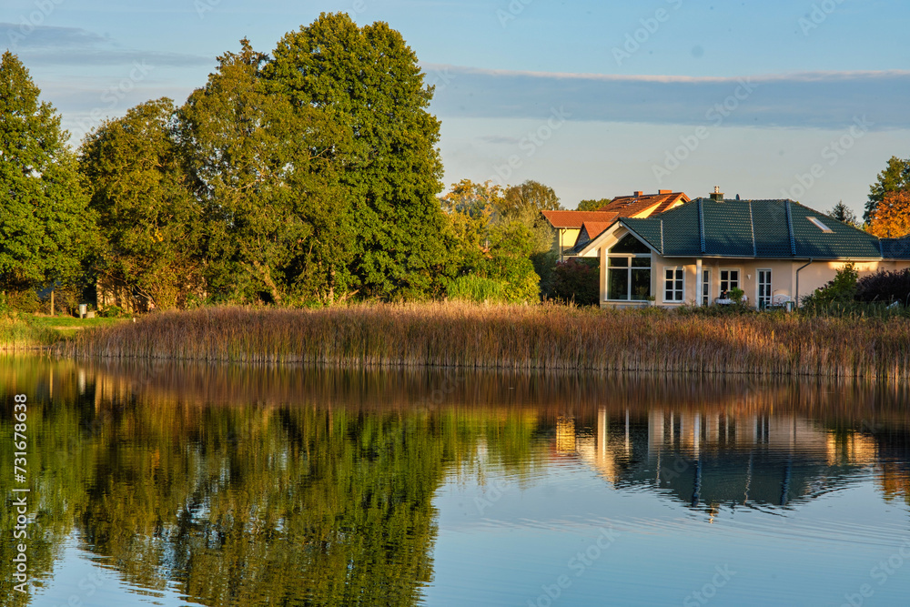 Natural landscape of the lake, high definition, the movement of waves against the background of the autumn forest. The reflection of clouds on the ripples of water. Germany. Natural landscape of the lake, high definition, the movement of waves against the background of the autumn forest. The reflection of clouds on the ripples of water. Germany.