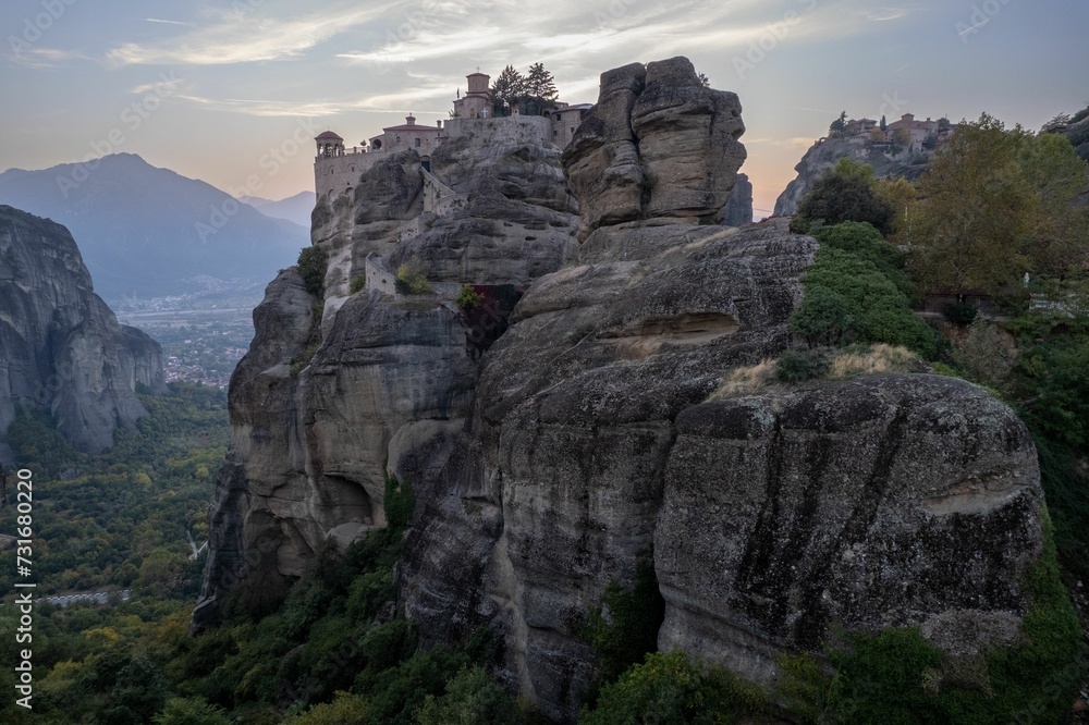 Aerial of the medieval Hilandar monastery in Greece on top of a huge cliff against the blue sky Aerial of the medieval Hilandar monastery in Greece on top of a huge cliff against the blue sky