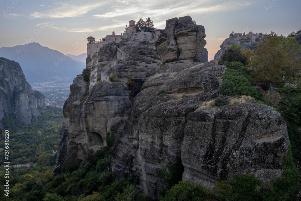 Aerial of the medieval Hilandar monastery in Greece on top of a huge cliff against the blue sky