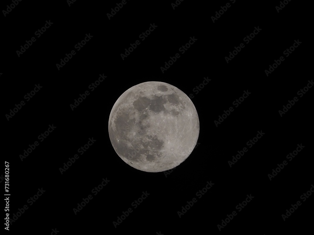 Bright full moon against a black background Bright full moon against a black background