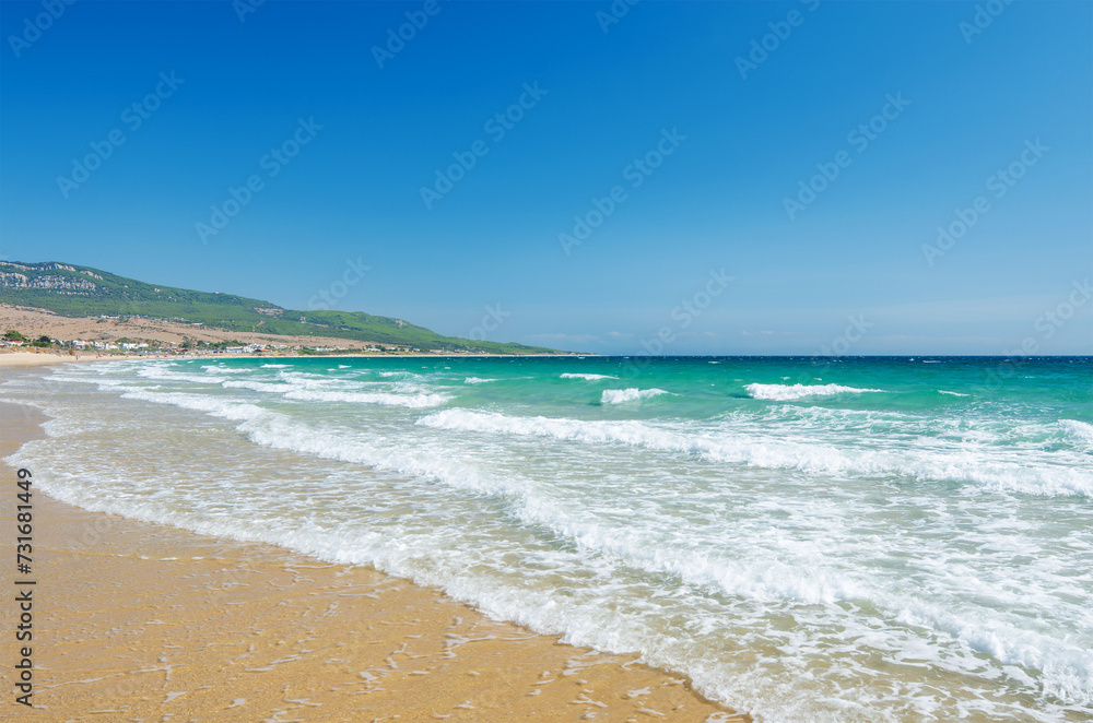 Beautiful waves on the beach Playa de Bolonia on the Atlantic coast of Tarifa, Province of Cadiz, Andalusia, Southern Spain.