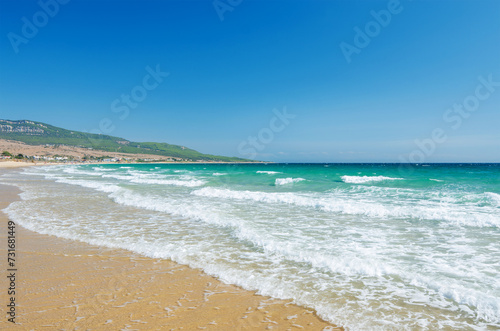 Beautiful waves on the beach Playa de Bolonia on the Atlantic coast of Tarifa, Province of Cadiz, Andalusia, Southern Spain. © kazmulka