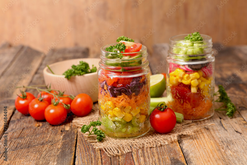 Vegetable salad in glass jar, rainbow mixed salad- health food, vegetarian food Vegetable salad in glass jar, rainbow mixed salad- health food, vegetarian food