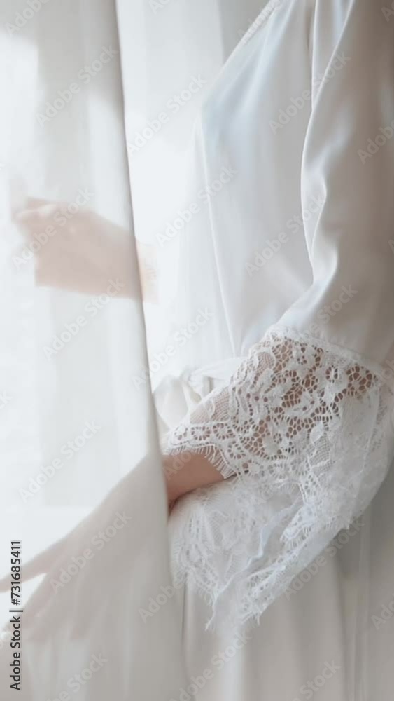 a beautiful sexy bride with a white veil in a peignoir in the morning goes to the bathroom getting ready for the wedding ceremony, a girl in a beautiful white dress
