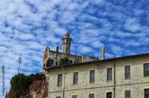 Scenic view of old buildings against a cloudy blue sky on Alcatraz Island, San Francisco