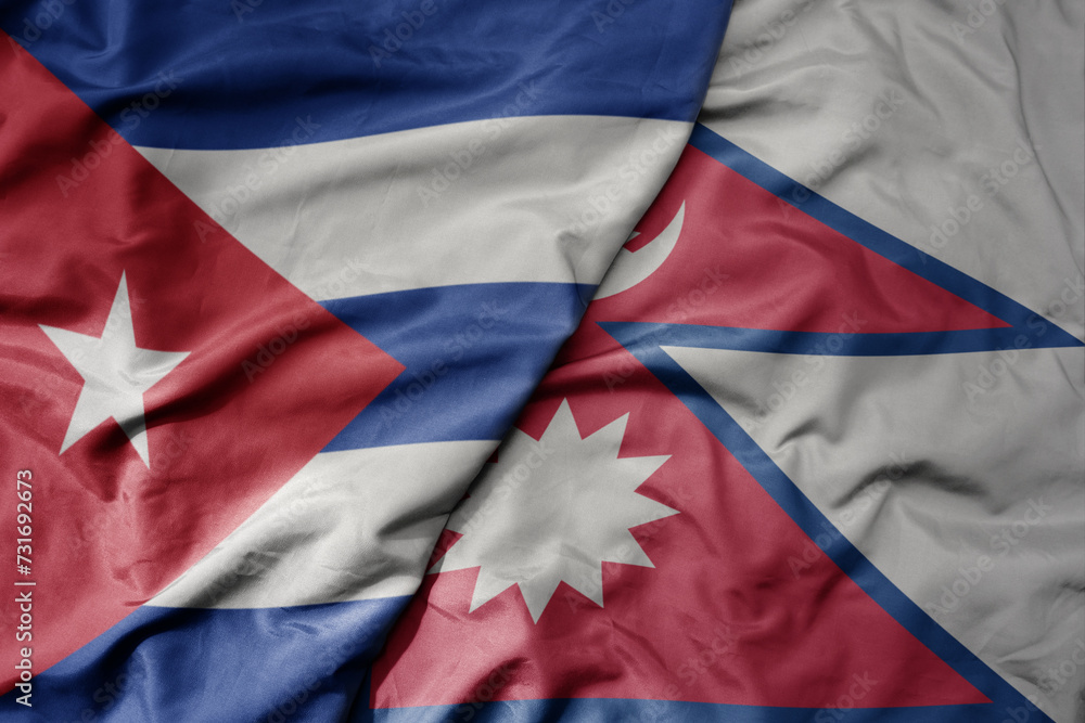 big waving national colorful flag of nepal and national flag of cuba . big waving national colorful flag of nepal and national flag of cuba .