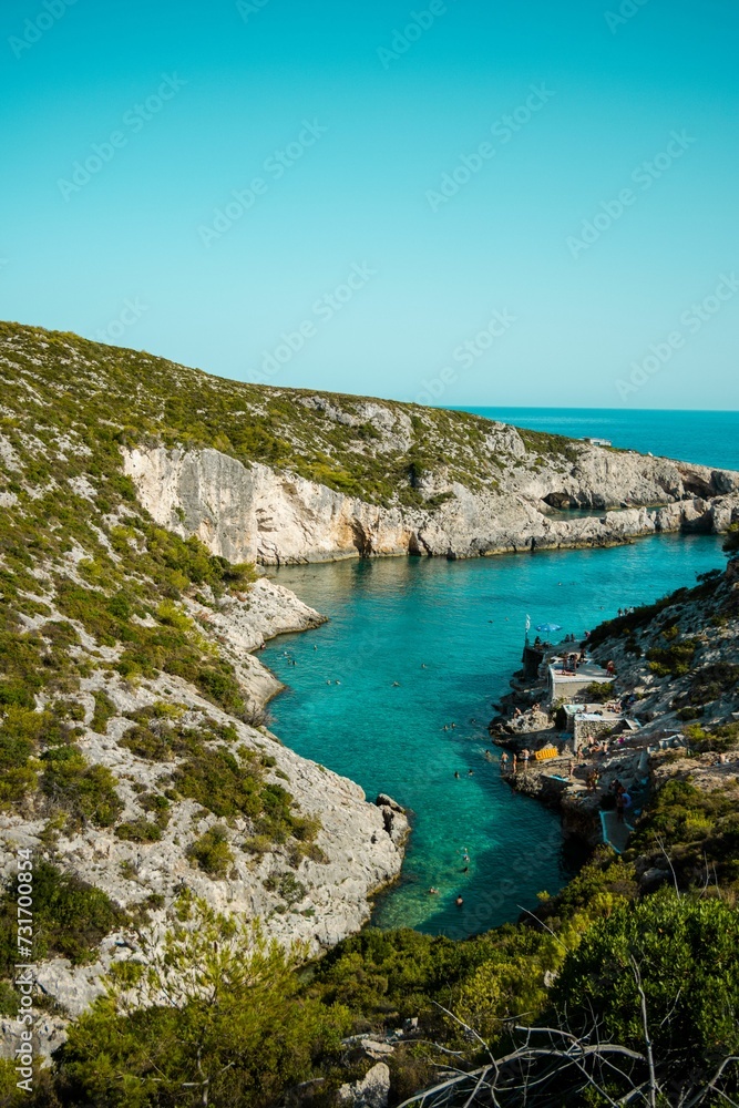 Fototapeta premium Idyllic landscape featuring a body of water against a backdrop of mountains and trees