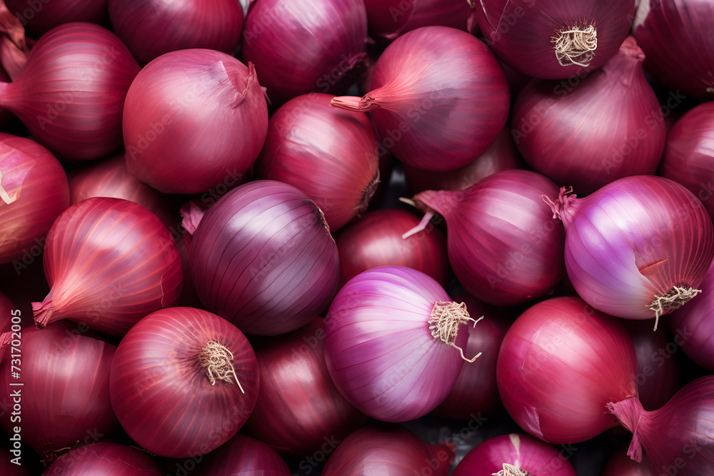 Top view of many raw whole red onions