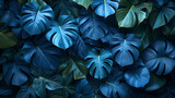 collection of tropical leaves foliage plant in blue color with space background. Exotic nature for cover template
