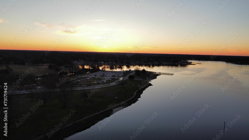 An aerial shot of a park near the lake
