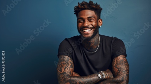 Wallpaper Mural young black, African American man with tattoo smiles. portrait of a generation Z guy. drawing on the skin Torontodigital.ca