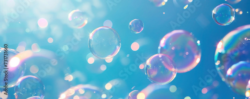 Abstract beautiful transparent soap bubbles floating on blue background