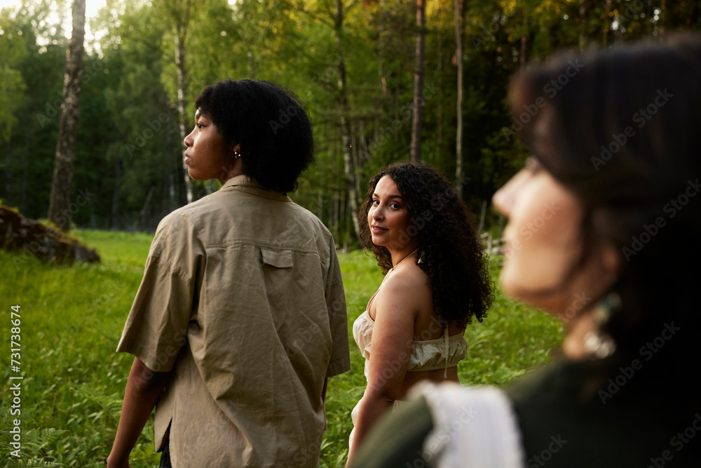 Young female friends walking in nature Young female friends walking in nature