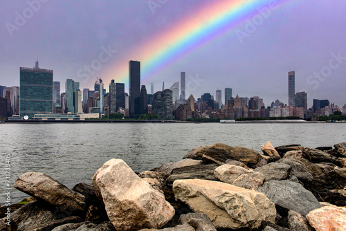 The skyline of the Big Apple with a rainbow seen from the cliff of Long Island which is an island that extends across New York (USA) and one of the best viewpoints in Manhattan.