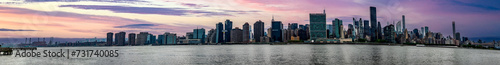 Great panoramic view of the Big Apple skyline seen at sunset from Long Island which is an island that extends across New York  USA  and one of the best viewpoints in Manhattan.