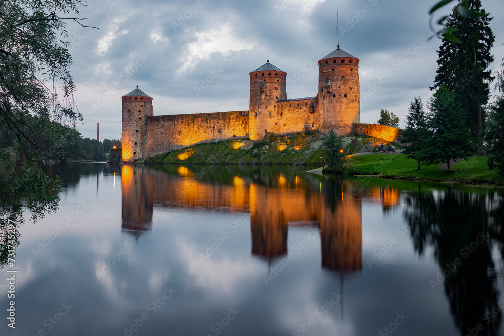Ancient Savonlinna fortress in a summer evening landscape. Finland