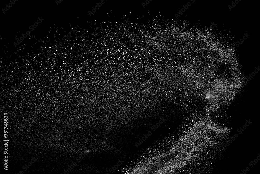Abstract white dust on black background. Light smoke texture. Powder explosion. Splash water overlay.