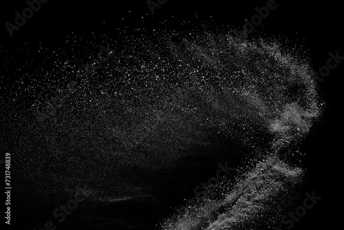 Obraz na płótnie Abstract white dust on black background. Light smoke texture. Powder explosion. Splash water overlay.
w salonie