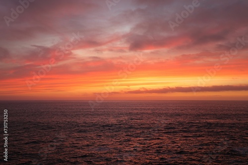 Mesmerizing view of the dusk in orange and pink colors on the Atlantic Ocean La Palma Canary Islands