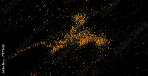 Close up turmeric scattered isolated on black, macro