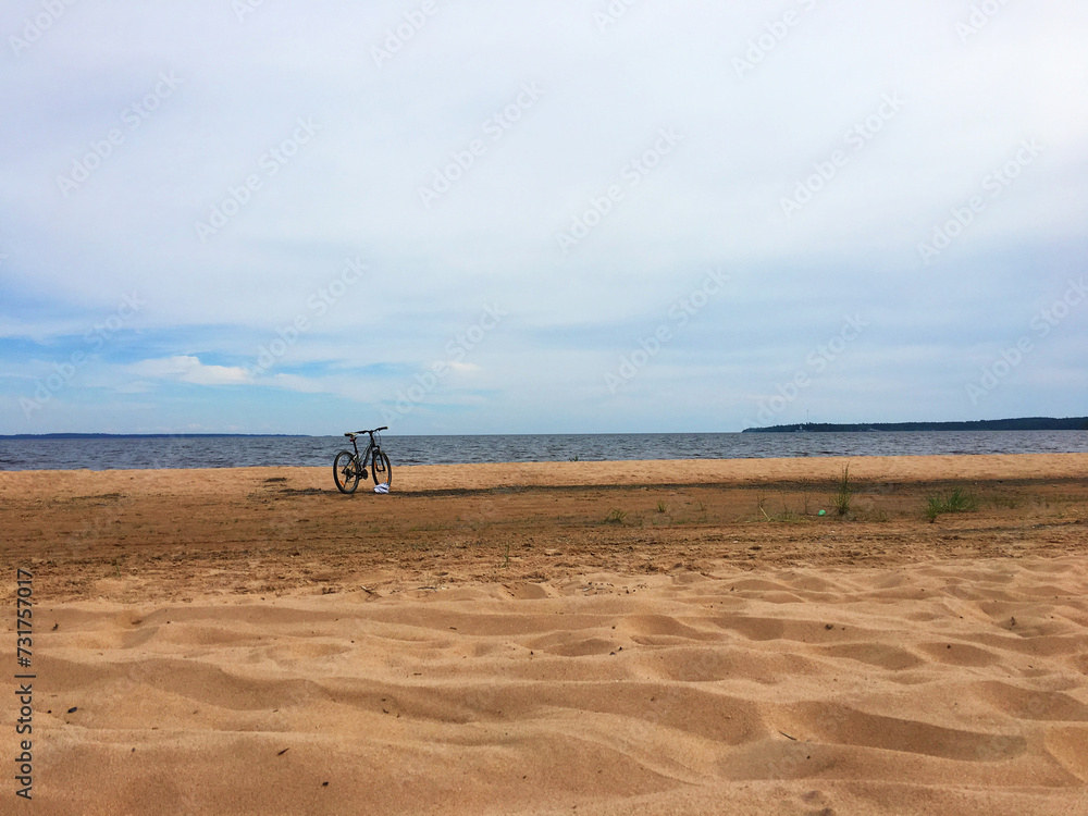 Bicycle by the sea on a sandy beach