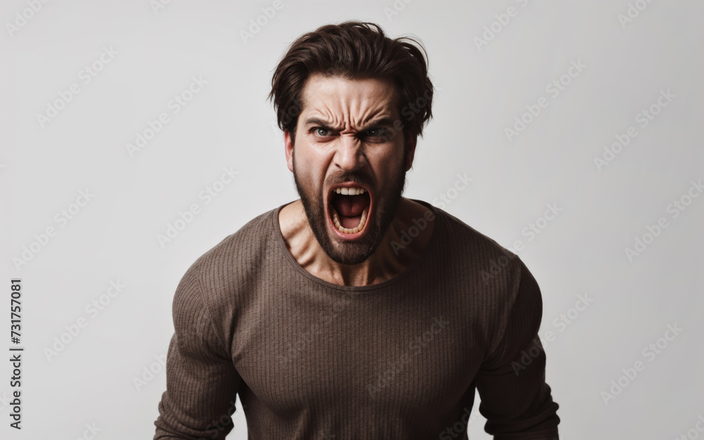 Portrait of a man who is screaming furiously, his face expresses anger and anger, his mouth and eyes are wide open. Portrait of a man who is screaming furiously, his face expresses anger and anger, his mouth and eyes are wide open.