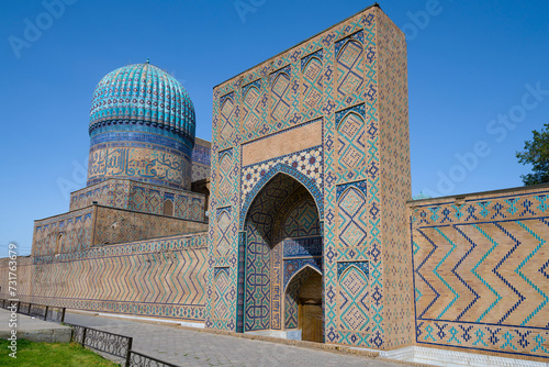 At the entrance to the medieval Bibi Khanum mosque on a sunny day, Samarkand