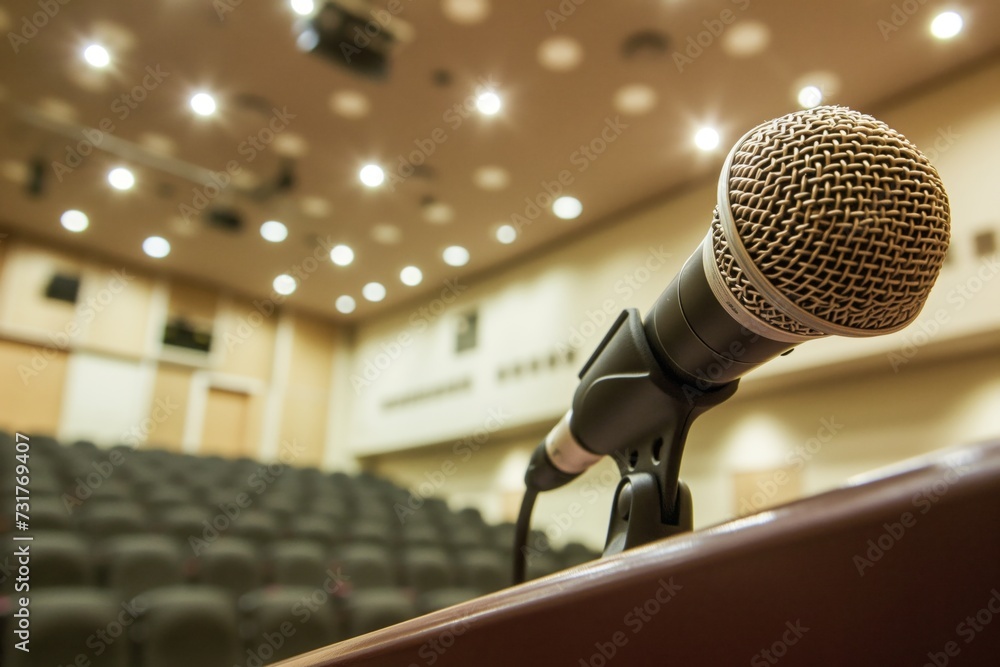 closeup of a microphone on a podium in lecture room closeup of a microphone on a podium in lecture room