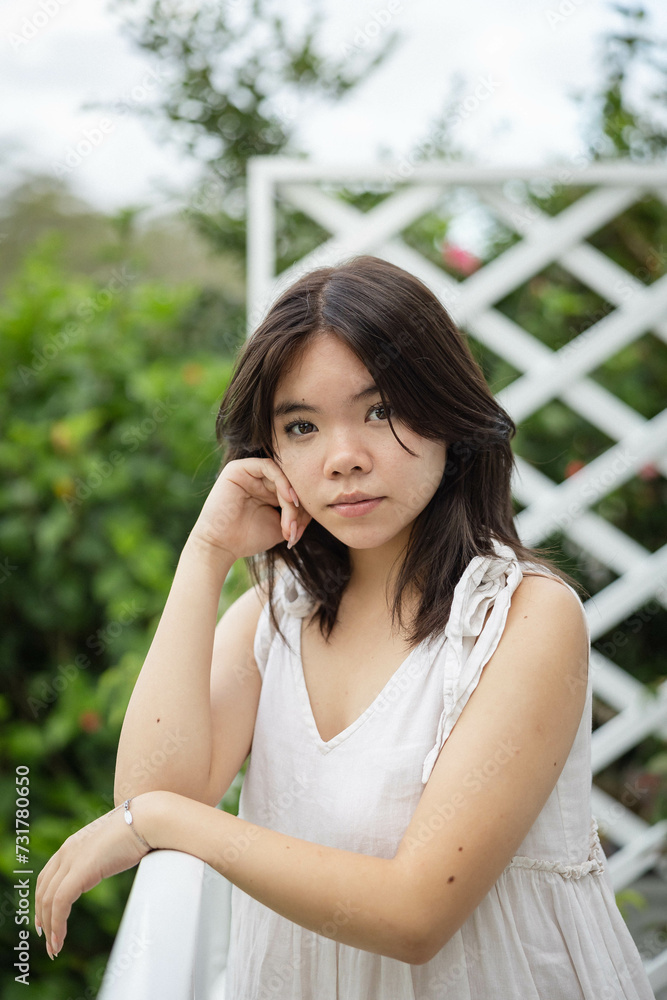 Portrait of teenage girl leaning on railing Portrait of teenage girl leaning on railing