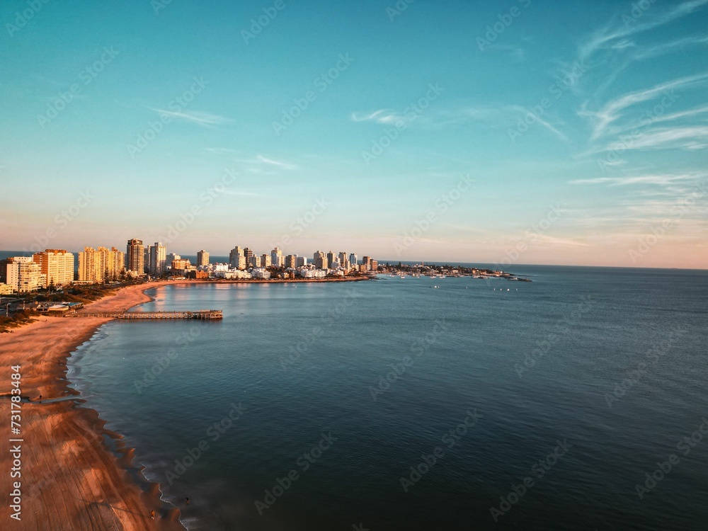 An aerial view of a beautiful sunset over Punta del Este beach