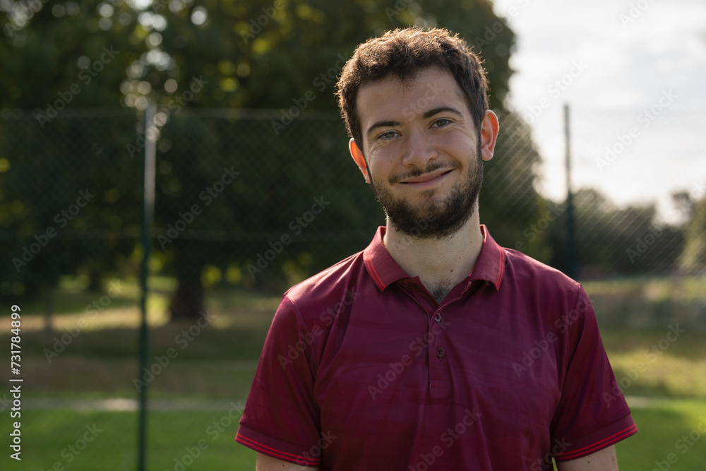 Portrait of smiling man standing in pickleball court Portrait of smiling man standing in pickleball court