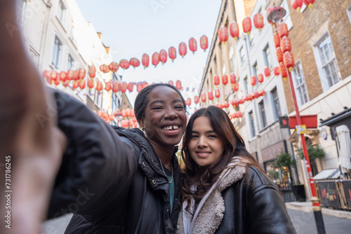 Portrait of two cheerful women in Chinatown