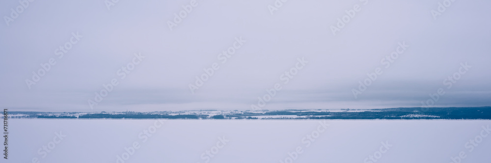 Lake Mjosa covered with ice, with a view towards Stange and Hedemarken.