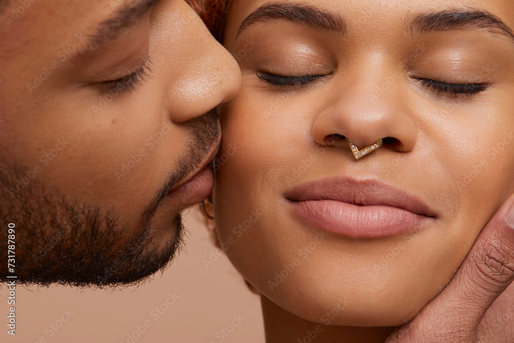 Studio portrait of kissing couple