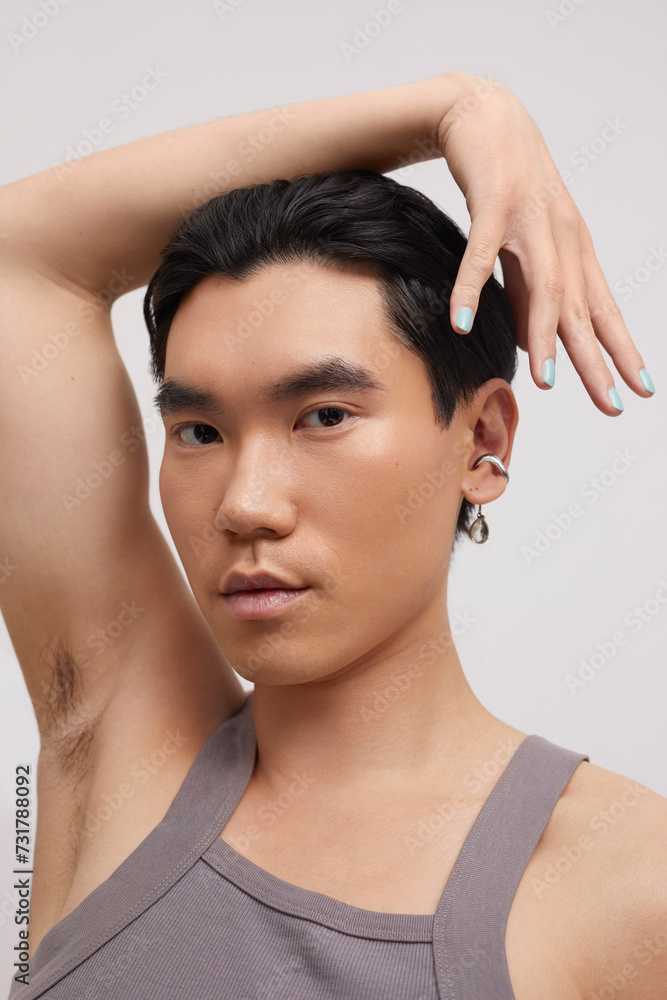 Studio portrait of handsome man with ear piercing Studio portrait of handsome man with ear piercing