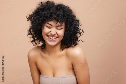 Studio portrait of beautiful laughing woman 