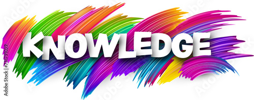 Knowledge paper word sign with colorful spectrum paint brush strokes over white.