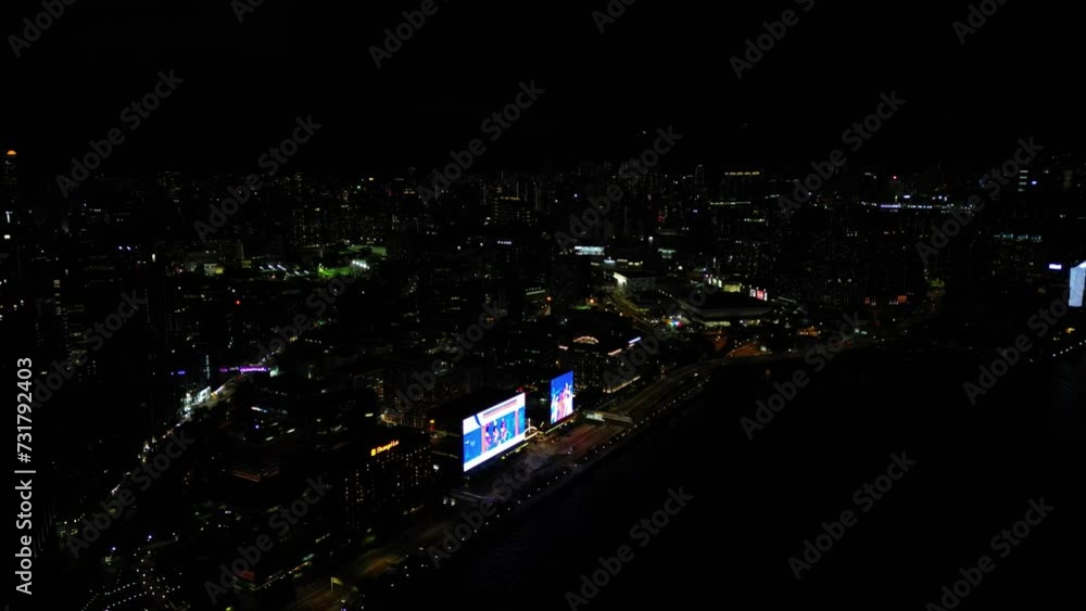 Aerial view of Hong Kong skyline illuminated at night in China Aerial view of Hong Kong skyline illuminated at night in China
