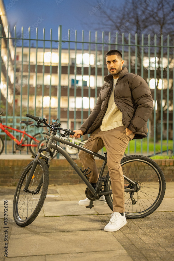 Obraz premium Portrait of young man on bicycle