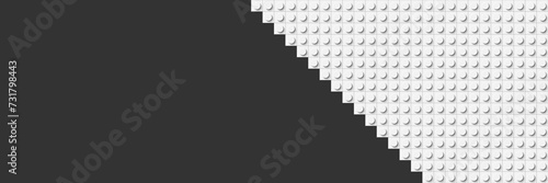 Grey plastic construction plate with white blocks with free space. Vector banner. Closeup plastic toy blocks. Abstract background