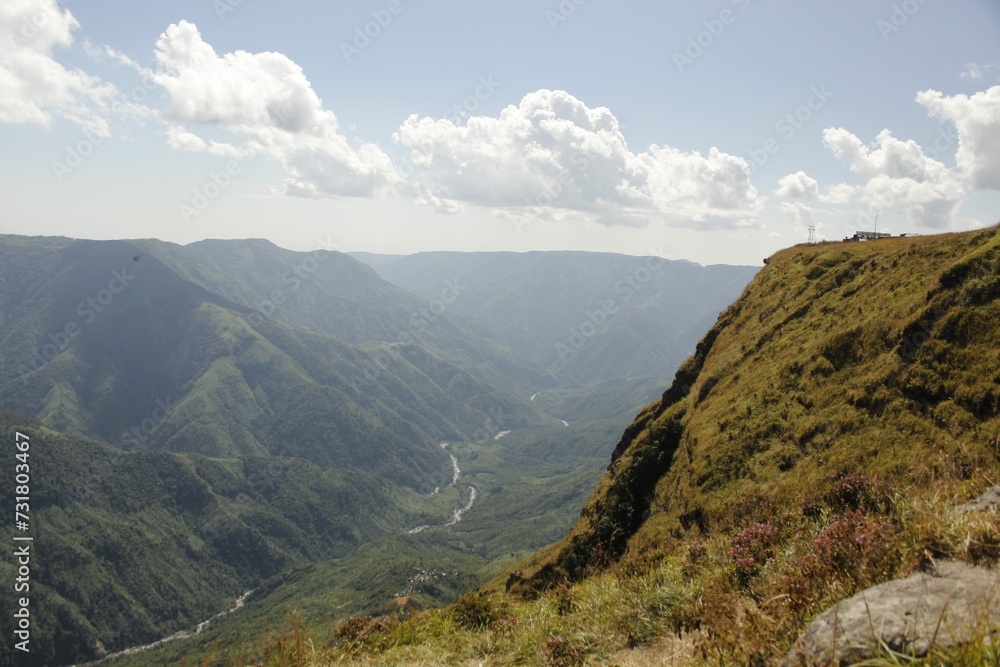 Beautiful landscape of lush green mountains on a bright sunny day